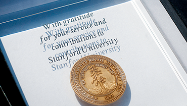 Lucite Stanford staff service award with embossed gold Stanford seal medallion