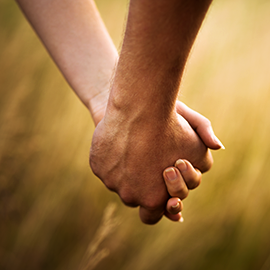 Photo of couple holding hands