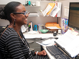 Female staff working at desktop computer