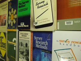 wall in bookstores with several books on the topic of survey research