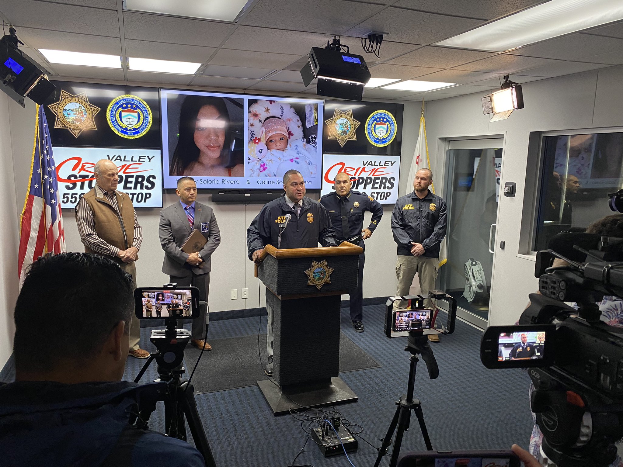 The photo is of a press conference with the ATF, the Fresno Police Department & Valley Crime Stoppers. The agencies are speaking in front of the media.