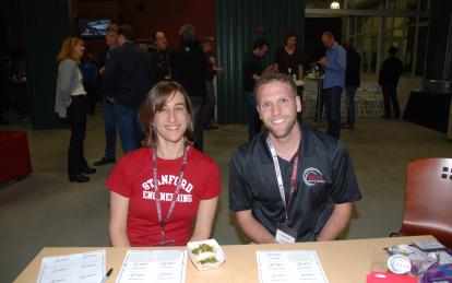 Students Sarah Thornton and Owen Falk greet guests at the front door of the event. (Photo courtesy of Dave Miller)