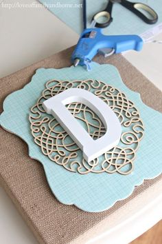 diy layered burlap monogram, crafts, decoupage, Hot glue your layers onto the burlap canvas