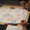 CDI participant Matteo Cargnello using paper and laptop to create a concept map. Photo by Steven Bell.