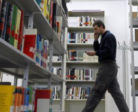 A man walks in Goethe Institute&#039;s library in Barcelona