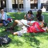 Student participants in the Leland Scholars Program at Stanford University share some down time on the lawn.