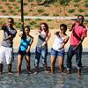 Five student preceptors from the 2012 Leland Scholars Program at Stanford University dance-posing in a fountain.