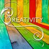 Creativity written on colorful background.