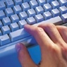 Hand on computer keyboard