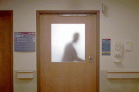 Silhouette in a hospital doorway