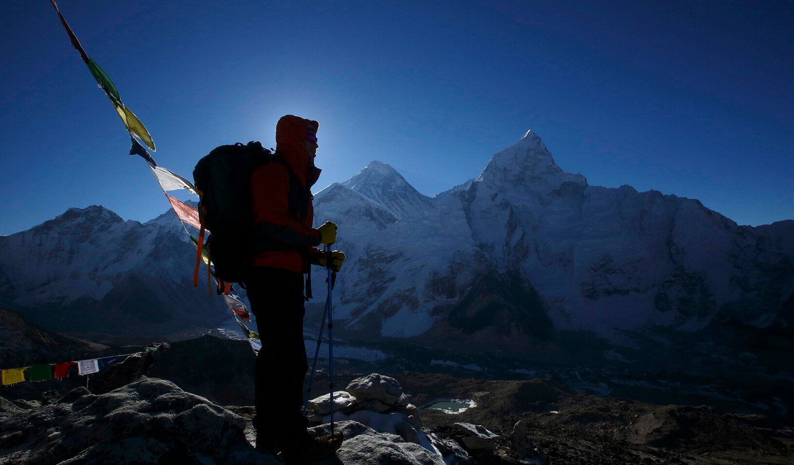 A trekker stands in front of Mount Everest | Reuters/Navesh Chitrakar