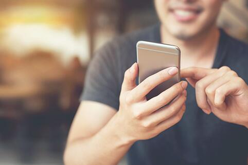 Person using a mobile phone to look at information