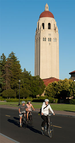 Bicyclists riding in front of Stanford Main Quad