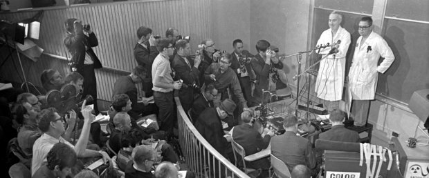 Drs. Norman Shumway, left, and Donald C. Harrison meet the press after they perform the first adult human transplant in the United States in January 1968.