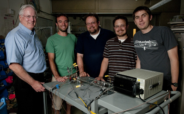 Professor Brian Cantwell, graduate student Yaniv Scherson, Professor Craig Criddle, and graduate students George Wells and Koshlan Mayer-Blackwell in the Cantwell lab with the nitrous oxide decomposition cell.