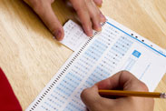 Photo of someone cheating on a test: Shutterstock.com