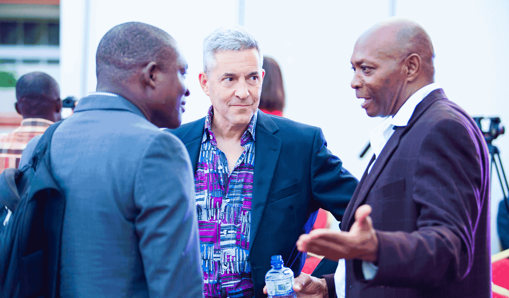 A photo in Ghana of businessman Richard Fadiora with SEED coaches Andrew Meade and Robert Mayberry