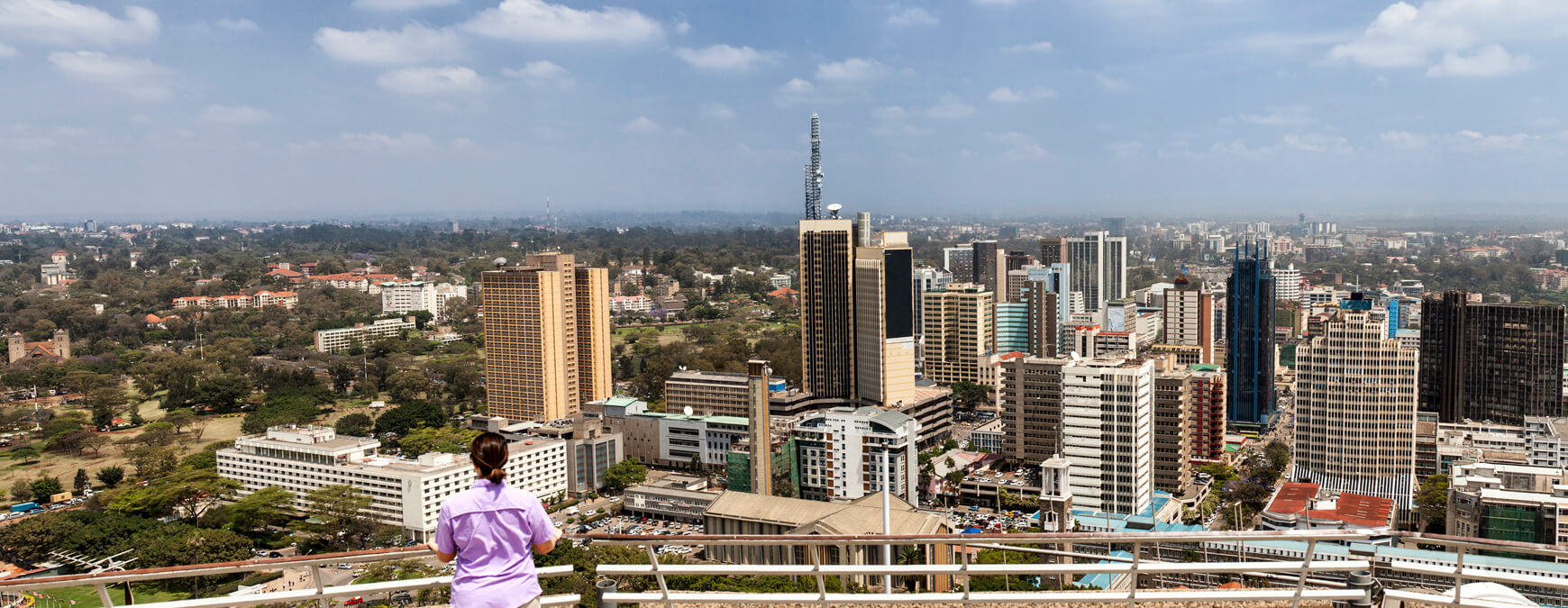 woman standing overlooking Nairobi