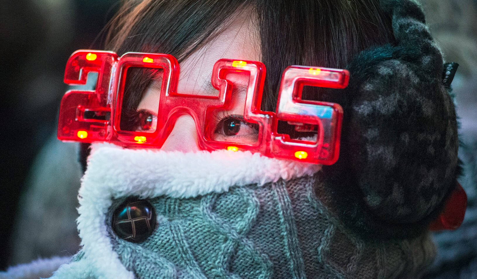  woman wearing 2015 glasses during New Year's Eve celebrations | Reuters/Stephanie Keith