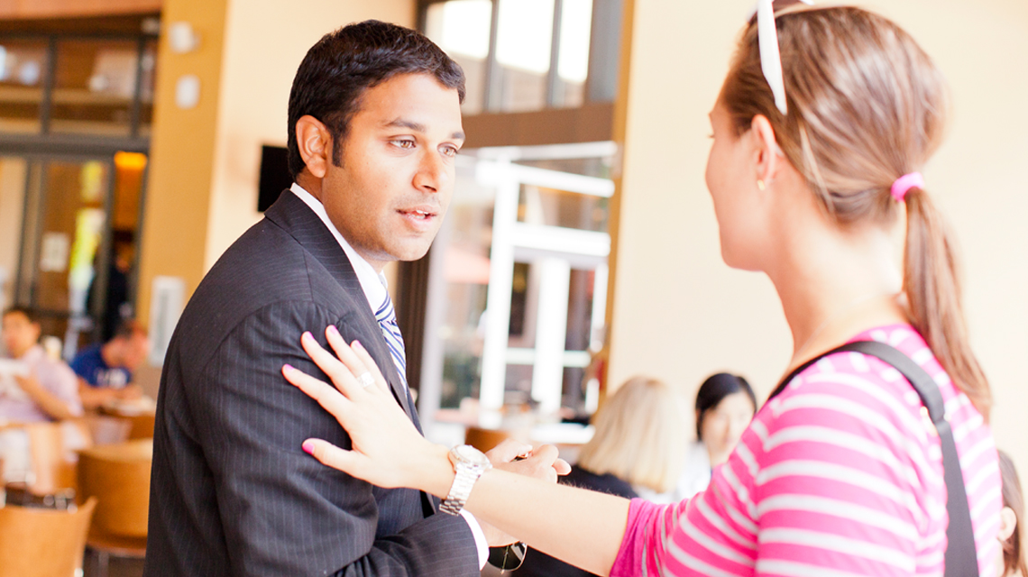 Woman talking with man