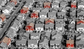 Photo illustration showing low-income housing options in a neighborhood by Tricia Seibold. Photo by iStock/David Sucsy