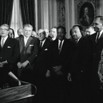 President Johnson signs the Civil Rights and Voting Rights Acts of 1965.