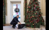 President Obama Opens A Christmas Gift