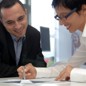 two people reviewing documents