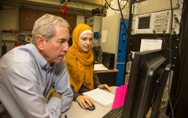 Mark Zoback with student in front of a computer