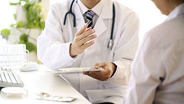 Photo of a doctor talking with patient