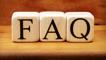 Wooden blocks reading "FAQ"