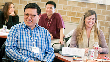 Diverse staff in classroom workshop setting