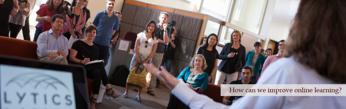 woman presents to a group of students about the Lytics Lab