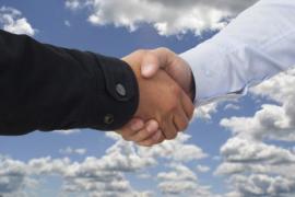 two people shaking hands as if making an agreement
