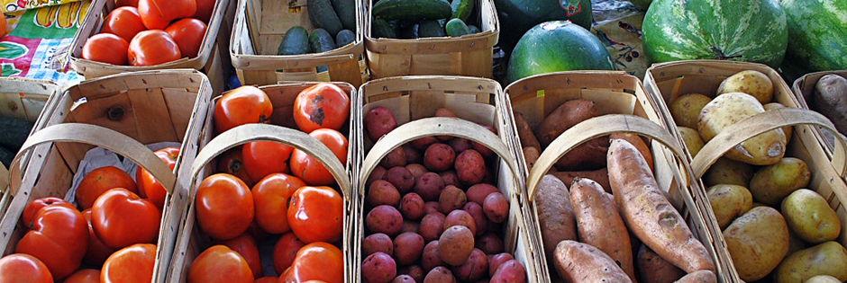 Economics (photos of vegetables in bins by gregw, Flickr).