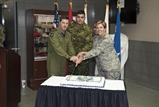 U.S. Air Force General Lori J. Robinson, Commander of the North American Aerospace Defense Command and U.S. Northern Command, Royal Canadian Air Force Lt. Gen. Pierre St-Amand, the NORAD Deputy Commander, U.S. Air Force Staff Sgt. Hillary Melton, and Canadian Army Corporal Alex Loiselle cut the traditional birthday cake during NORAD’s 59th Anniversary cerebration  on Peterson AFB, CO May 12th. (DoD Photo by: N&NC Public Affairs/Released)