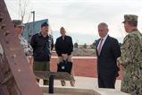 Defense Secretary Jim Mattis talks to members of the military.