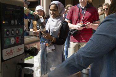 TEDxStanford audience members are treated to a cup of Smitten Ice Cream. (Photo: Tamer Shabani)