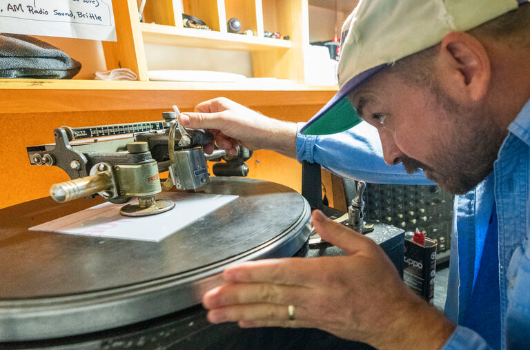 Moose Adamson sets up the lathe at Joyful Noise Recordings in Indianapolis. The specialty label cuts records individually on a 1940s-vintage machine.