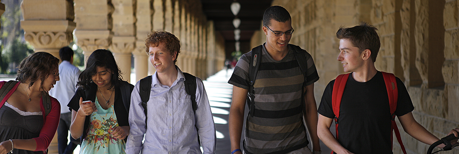 Undergraduate students commute along the Quad arcade between classes. Photo by Ian Terpin.