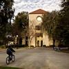 Student heading towards Sweet Hall on a bicycle. Photo by Linda A. Cicero / Stanford News Service.