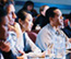 people sitting in a meeting room listening to a presentation