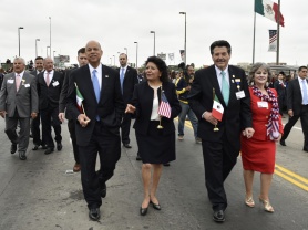 Secretary Johnson walks with others at the International Bridge Ceremony