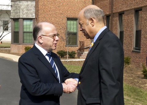 Secretary Johnson and Minister Cazeneuve shake hands