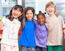 children hugging and smiling