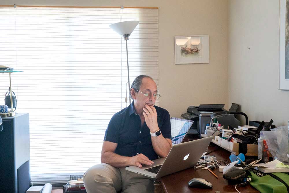 Michael Levitt works in his home office on the Stanford campus