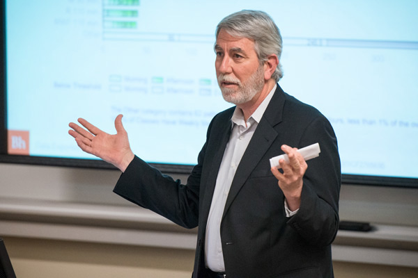 University Registrar Tom Black presents his report on managing classroom scheduling to the Faculty Senate.