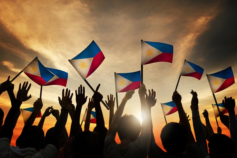 Filipinos waving national flag