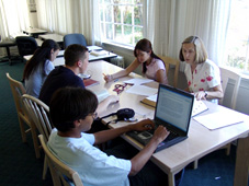 Students Sitting at Conference Table