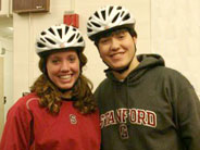 2 students wearing bike helmets